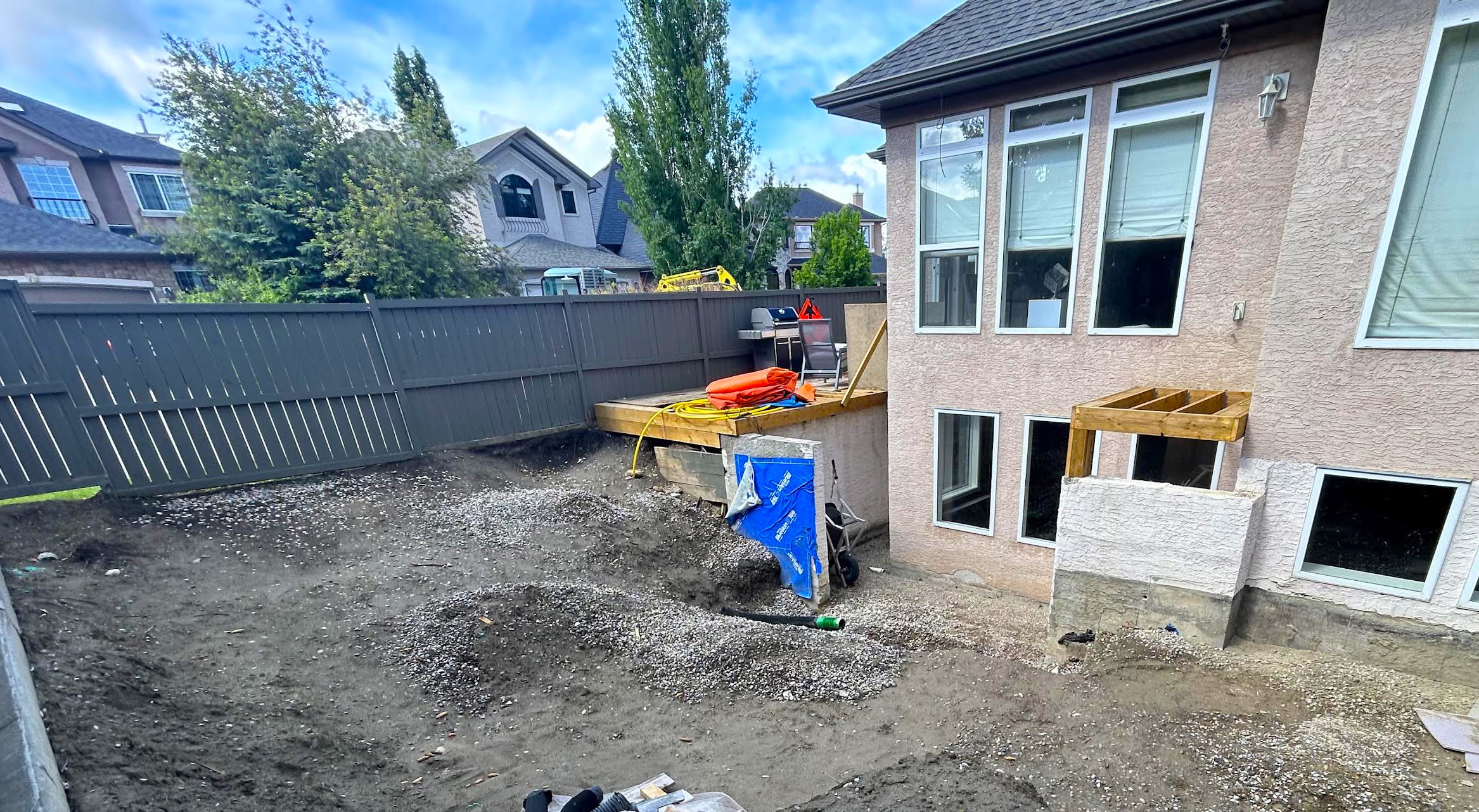 Evergreen backyard after — finished multi-level entertaining space