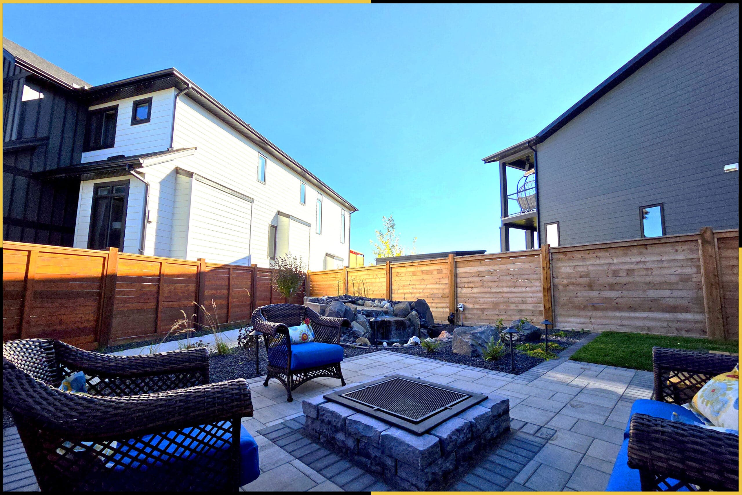 After — firepit patio with the water feature in the back corner